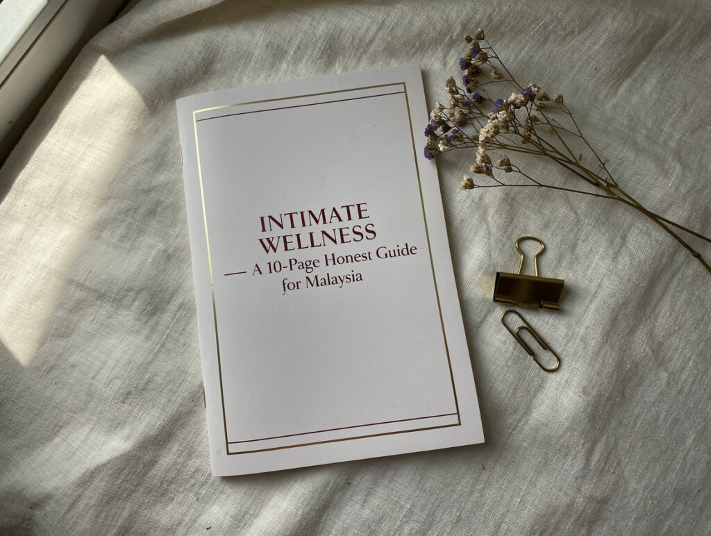 Maison Velvetia free 10-page intimate wellness guide PDF cover, flat lay photo on ivory linen with burgundy and gold accent colors